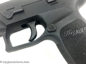 The Sig P320 has a reversible magazine release button.